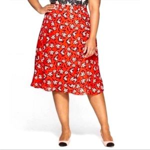 NWT who what wear red floral skirt with solid red lining and zip closure.